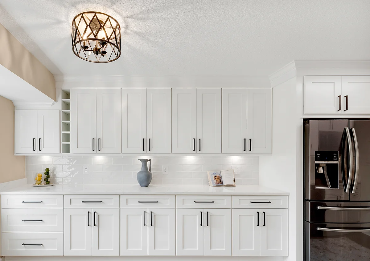 Cozy kitchen redesign showcasing warm wood-toned kitchen cabinets and a functional tile kitchen floor in Maryland.